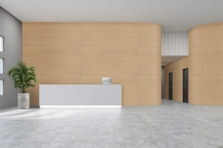 Empty office hall with wooden and gray walls and concrete floor. Concept of a modern company grounds. 3d rendering. Mock up.